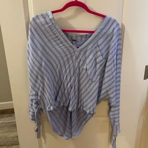 Long sleeve top with front pocket and tie sleeves